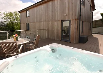 Fantastic enclosed decked area with hot tub and seating