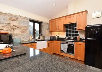 Cook up a good meal in the well-equppied kitchen