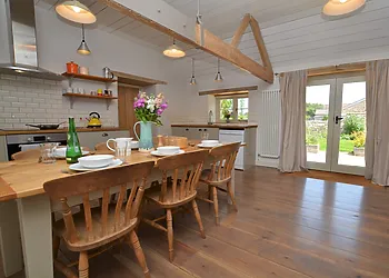 Dining area with French doors opening out to the enclosed garden