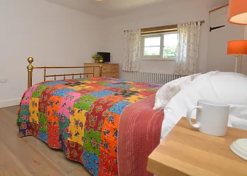 En-suite king size bedroom with TV