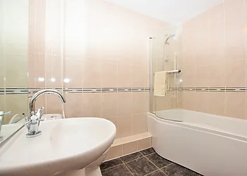 Bathroom with shower over bath