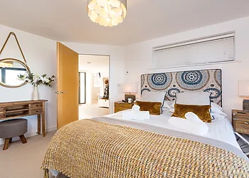 Master bedroom with en-suite and bifold doors 