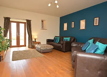 Lounge with french door leading to garden