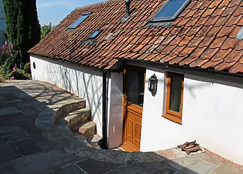 Looking towards the property accessed down large stone steps