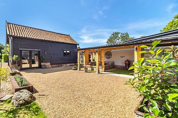 A single-storey barn conversion on the Suffolk and Norfolk border