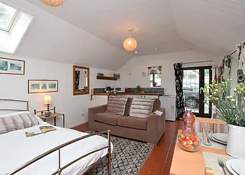 Open plan sleeping/lounge area