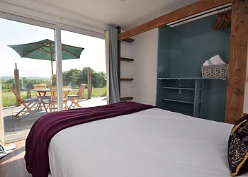 Double bedroom with bi-fold doors to the decking