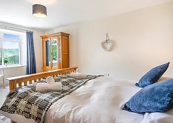 With lovely views of the surrounding garden and grounds of the property