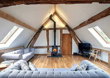 The beautiful lounge offers comfortable seating and a roaring woodburner