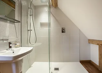 Completing the super-king-size bedroom is an en-suite shower room