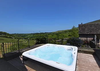Decked area with hot tub