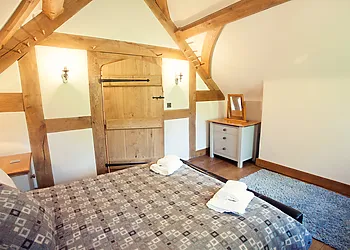 Farmhouse bedroom with exposed beams