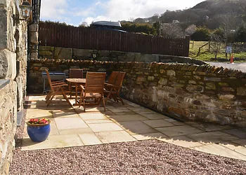 Gravelled courtyard with furniture 