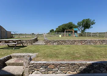 Spacious garden with childrens climbing frame