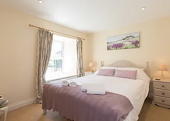 King size bedroom with lovely muted colours