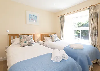 The twin bedroom is just as light and spacious