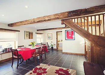 Second dining room with sofa bed located in the upper barn