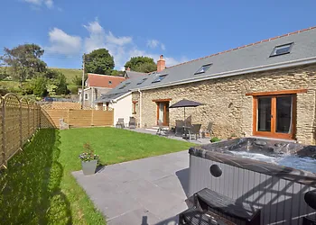 Stay in this beautiful converted barn including private hot tub