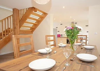 Dining area with feature stairway
