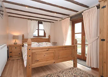 Double bedroom with door to outside