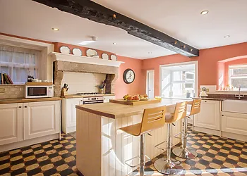 The kitchen is modern yet retains its character 