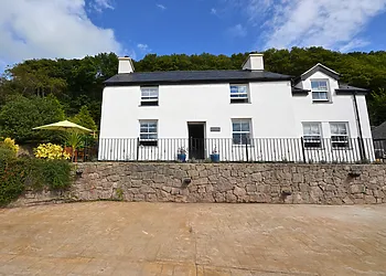 Steps lead up from the courtyard to this handsome property