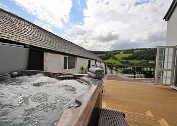Relax in the hot tub and admire the incredible views