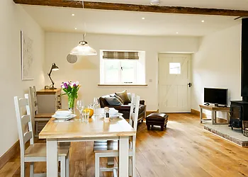 Beautiful lounge/diner with exposed beams