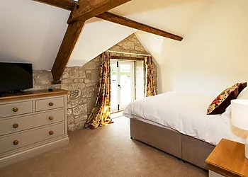 King-size bedroom with dormer window and stunning countryside views