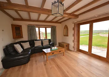 Open-plan lounge area with wood burner