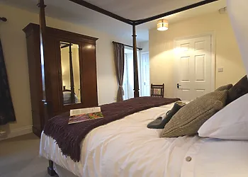 Sumptuous four poster bed in the double bedroom