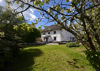 Quintessential white washed thatched cottage