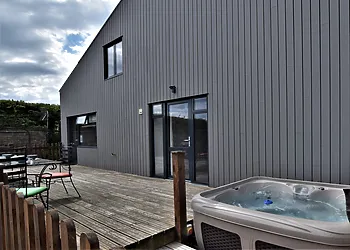 Relax in the hot tub after a day exploring