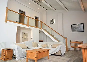 Double height ceiling in the lounge with gallery landing