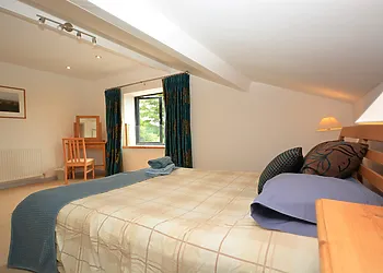 King-size bedroom on the first floor with distant views