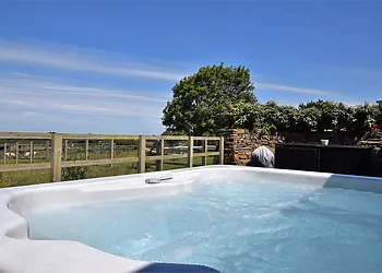 Relax in the hot tub and enjoy the stunning views