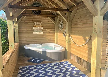 Sheltered hot tub with views of the garden