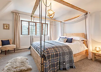 Four-poster bedroom with views over the front garden