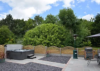 Rear garden with hot tub & patio area