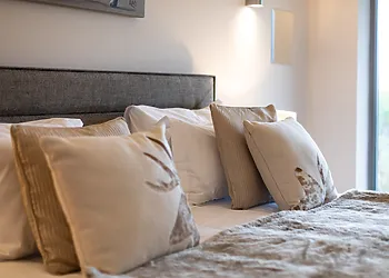 Delicate neutral tones complete the bedroom