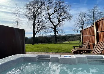 Enjoy the wonderful countryside views from the private hot tub