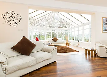 Second lounge leading to conservatory with river views