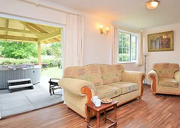 Lounge area with doors to the garden and hot tub