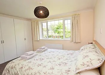 King size bedroom with views over the garden