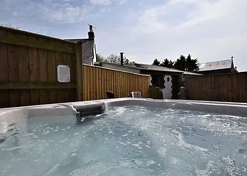 View from the hot tub back to the cottage