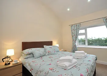 A colourful double bedroom