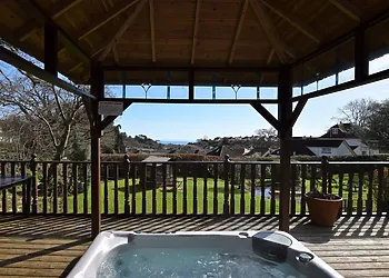 Enjoy the private hot tub with far reaching sea views over Torbay