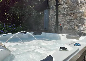 Hot tub with outside shower