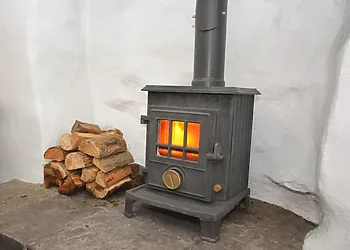 Warming wood burner with plenty of logs