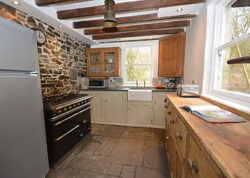 Solid wood kitchen looking out to the garden